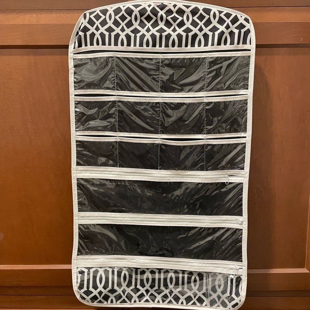 Jewelry hanger. Holds multiple pieces of jewelry for organization.